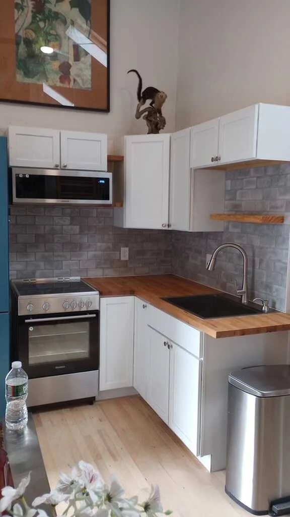 Kitchen backsplash and custom butcher block shelving